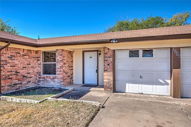 entrance to property featuring a garage