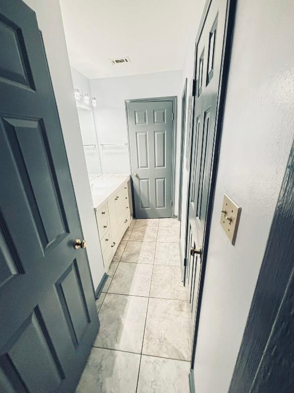 bathroom featuring vanity and tile patterned floors