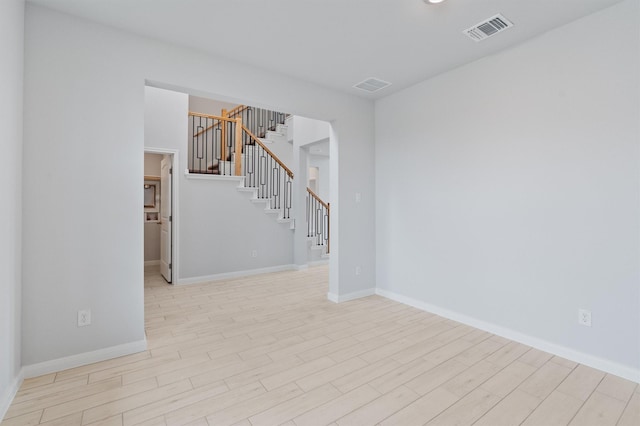 empty room with light hardwood / wood-style floors