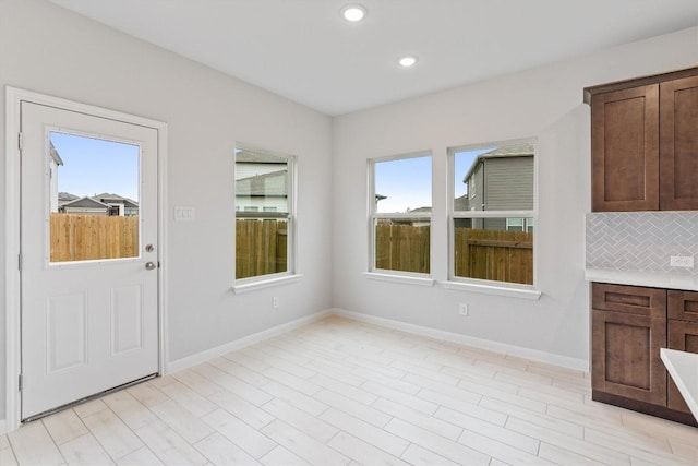 unfurnished dining area with a healthy amount of sunlight