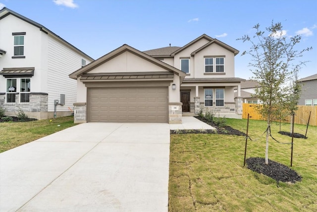 view of front of home with a front lawn and a garage