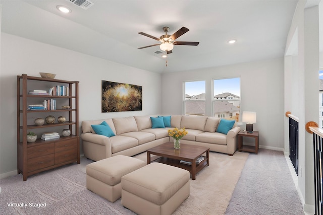 living room with light carpet and ceiling fan