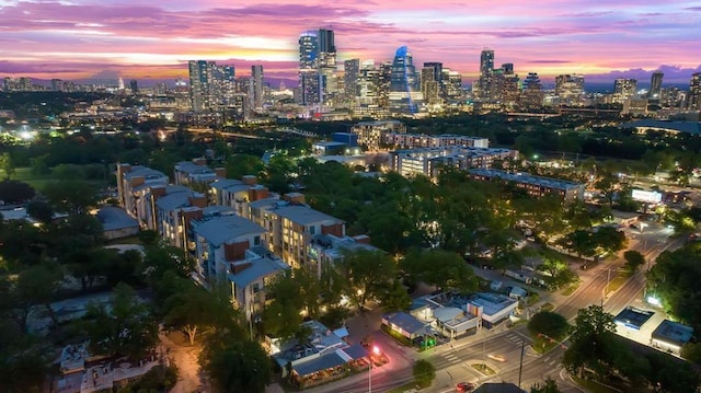 birds eye view of property featuring a city view