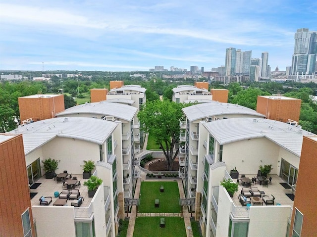 birds eye view of property with a view of city