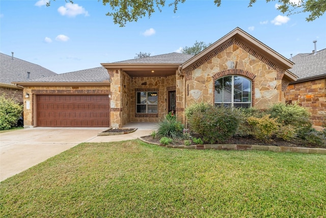 view of front of home featuring a front yard and a garage