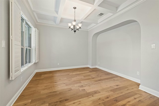 spare room with an inviting chandelier, coffered ceiling, beam ceiling, and light wood-type flooring