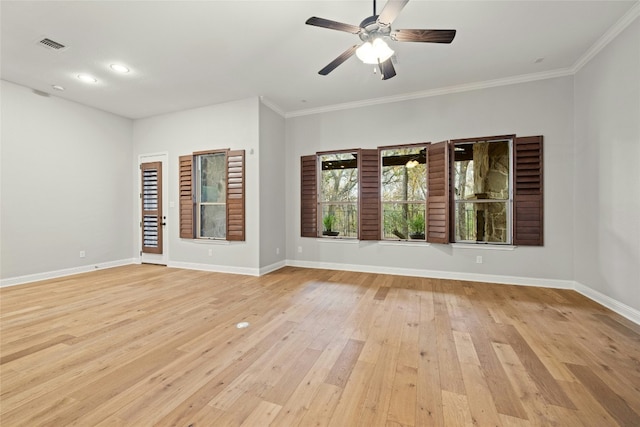 unfurnished room with ornamental molding, ceiling fan, and light wood-type flooring