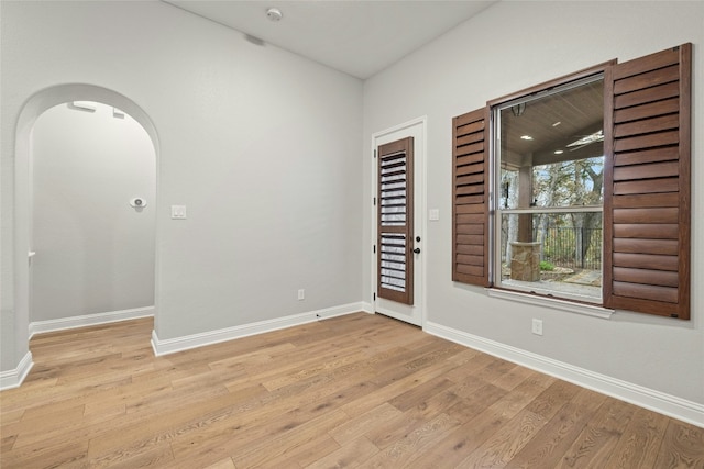 unfurnished room with light hardwood / wood-style flooring