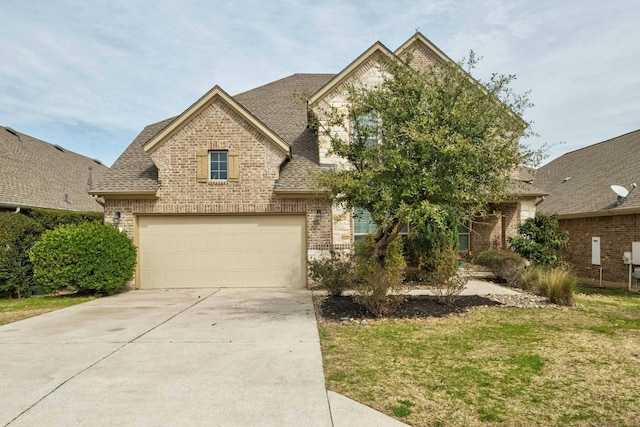 view of front of property featuring a garage and a front yard