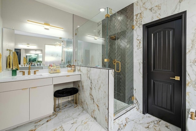 bathroom with vanity and a shower with door