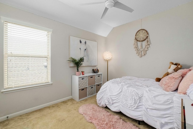 bedroom featuring light carpet, vaulted ceiling, and ceiling fan