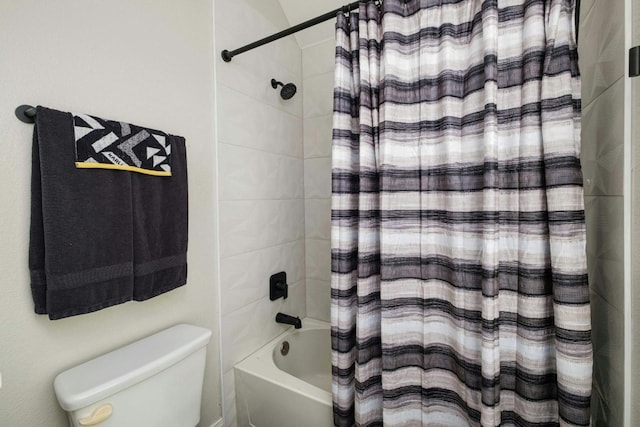 bathroom with toilet and shower / tub combo