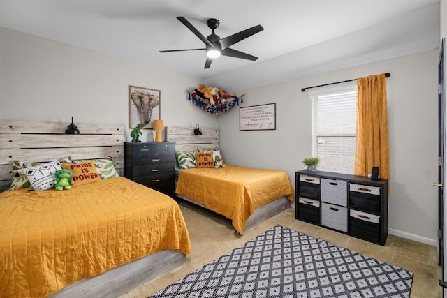 bedroom featuring light carpet and ceiling fan