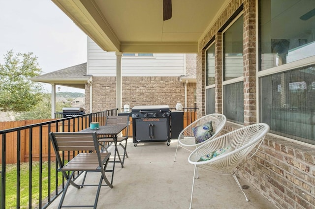 balcony featuring a grill and ceiling fan