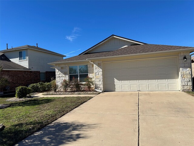 ranch-style home with a garage