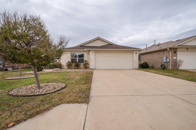 ranch-style home featuring a front yard and a garage