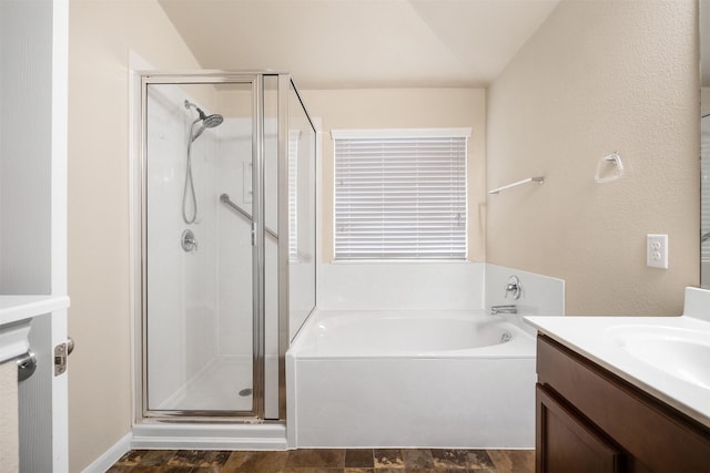 bathroom featuring vanity and plus walk in shower