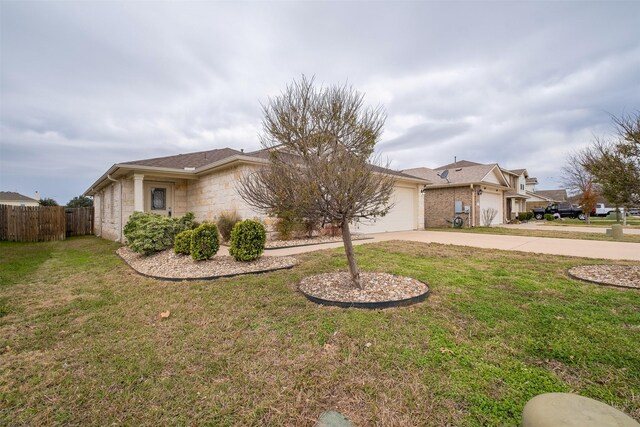 ranch-style home with a front yard and a garage