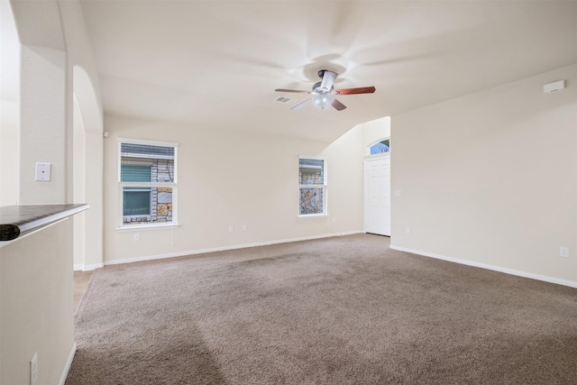 unfurnished room featuring ceiling fan and carpet