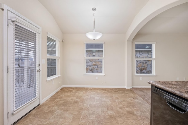 unfurnished dining area with lofted ceiling