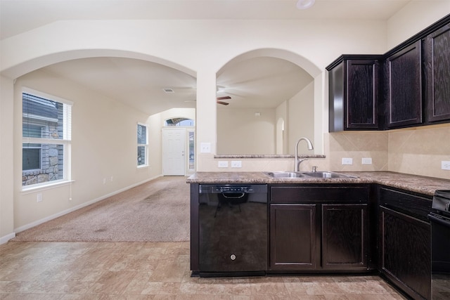 kitchen featuring ceiling fan, black dishwasher, decorative backsplash, light colored carpet, and sink