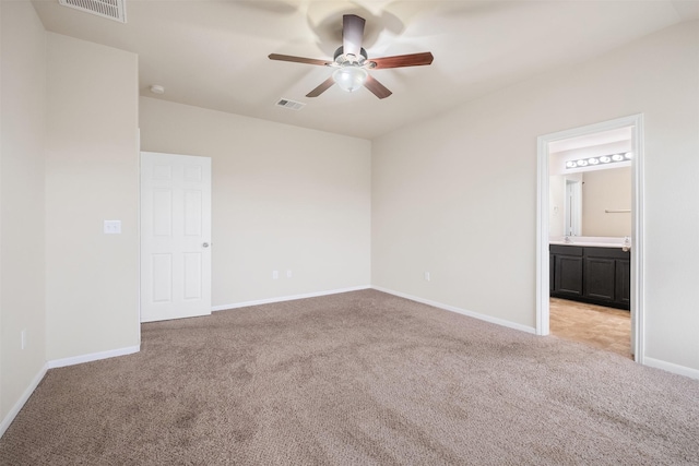 carpeted empty room with ceiling fan