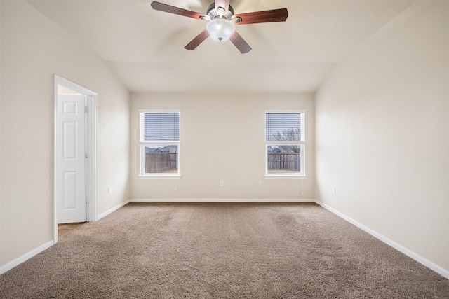 carpeted empty room with ceiling fan and vaulted ceiling