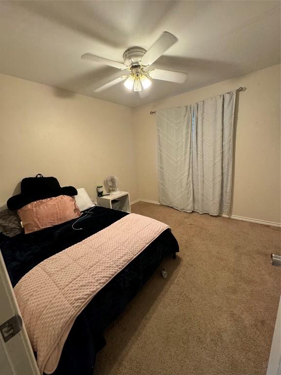 bedroom featuring carpet and ceiling fan