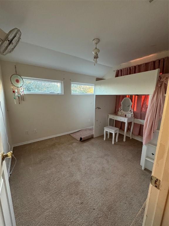 unfurnished bedroom with carpet flooring