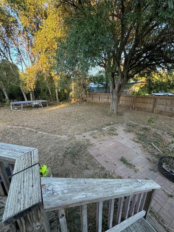 view of yard with a patio area and a trampoline