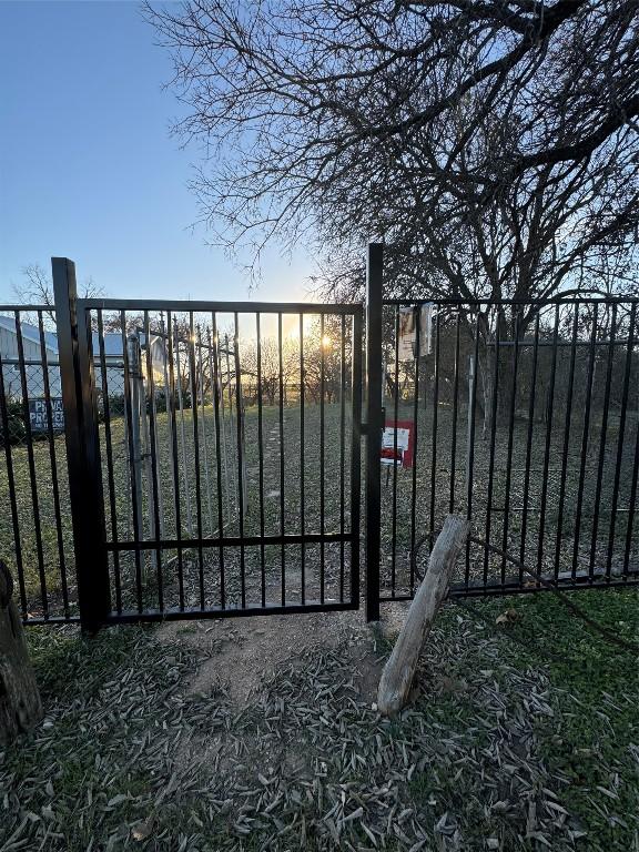 282 Spring River Dr, Martindale, TX 78655 - view of gate at dusk