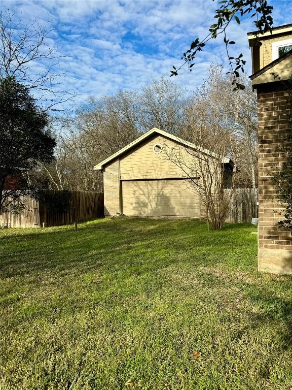 282 Spring River Dr, Martindale, TX 78655 - view of yard featuring a garage
