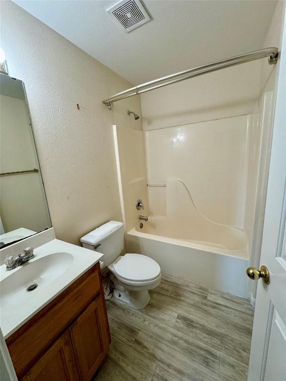 282 Spring River Dr, Martindale, TX 78655 - full bathroom featuring vanity, shower / bathtub combination, and wood finished floors