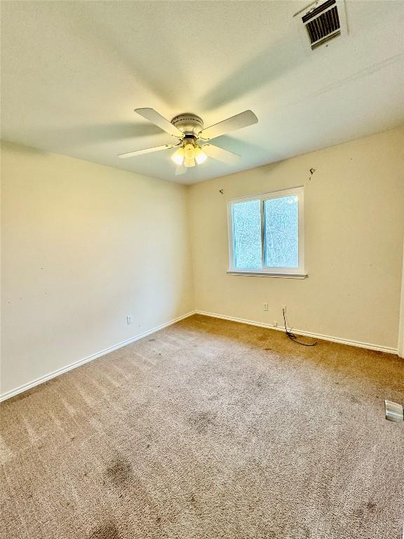 282 Spring River Dr, Martindale, TX 78655 - carpeted empty room with baseboards and ceiling fan