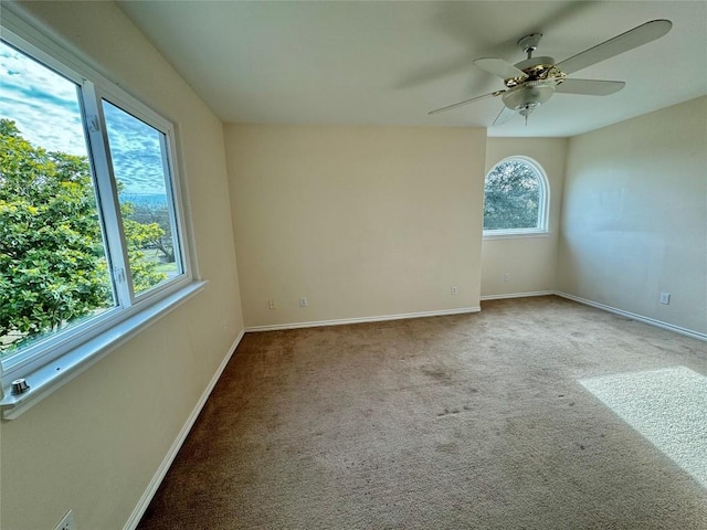 282 Spring River Dr, Martindale, TX 78655 - carpeted empty room with baseboards and a ceiling fan