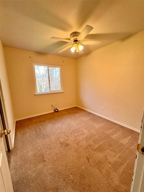 282 Spring River Dr, Martindale, TX 78655 - carpeted empty room featuring ceiling fan and a textured ceiling