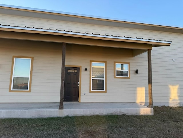 427 Pintail Loop, San Marcos, TX 78666 - view of exterior entry featuring a metal roof