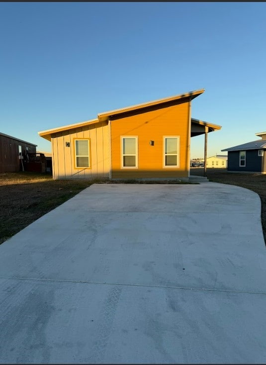 427 Pintail Loop, San Marcos, TX 78666 - view of front of house with concrete driveway and board and batten siding
