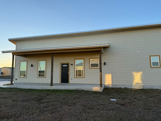 427 Pintail Loop, San Marcos, TX 78666 - back of property with a patio area and a lawn