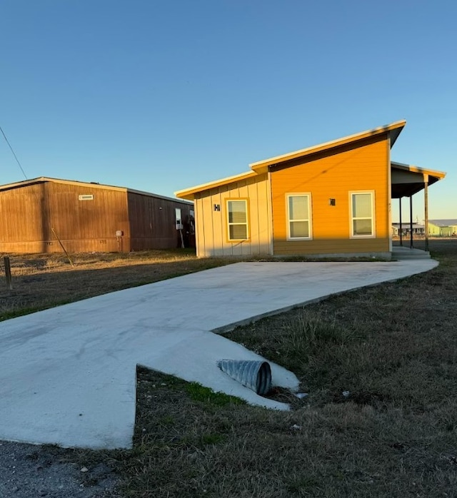 427 Pintail Loop, San Marcos, TX 78666 - rear view of property featuring board and batten siding and an outbuilding