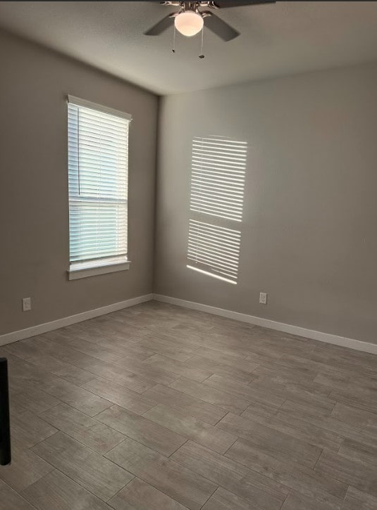 spare room with ceiling fan