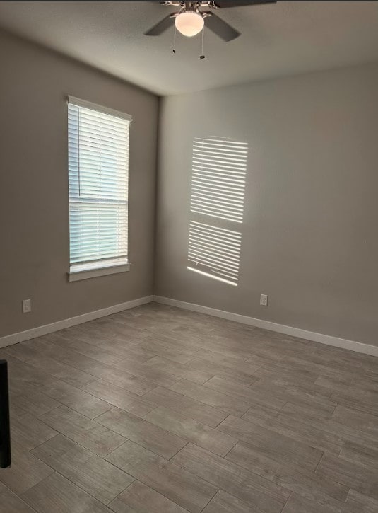 427 Pintail Loop, San Marcos, TX 78666 - spare room with ceiling fan and wood finished floors