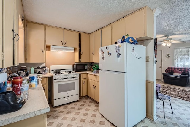 kitchen with ceiling fan, white appliances, and a textured ceiling