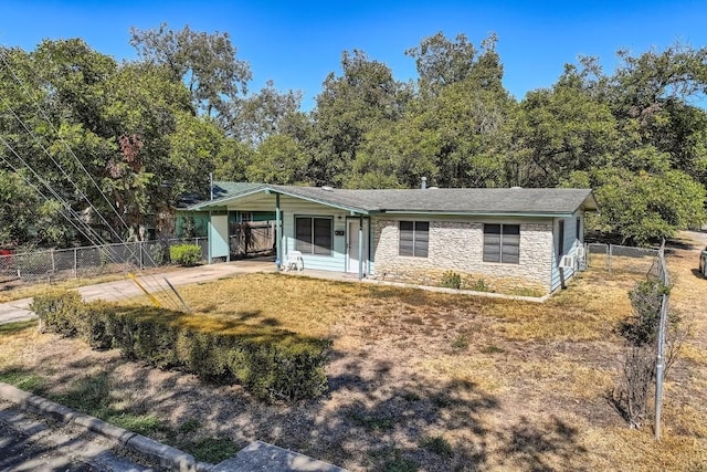 view of front facade with a front lawn and a carport