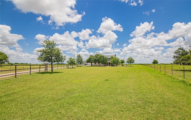 view of yard with a rural view