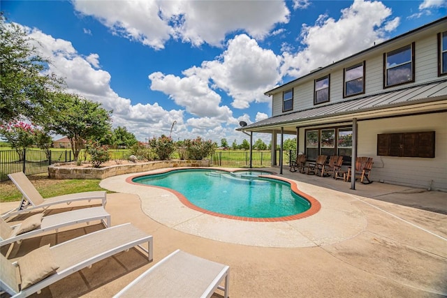 view of pool featuring an in ground hot tub and a patio