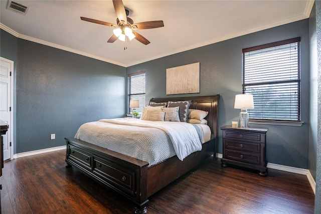 bedroom featuring ornamental molding, ceiling fan, and dark wood-type flooring