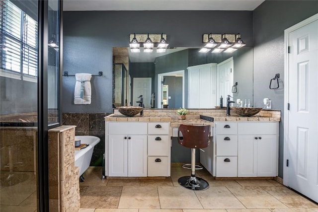 bathroom featuring tile patterned flooring, vanity, and separate shower and tub