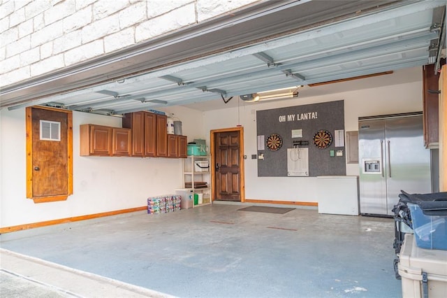 garage featuring a garage door opener, fridge, and built in fridge