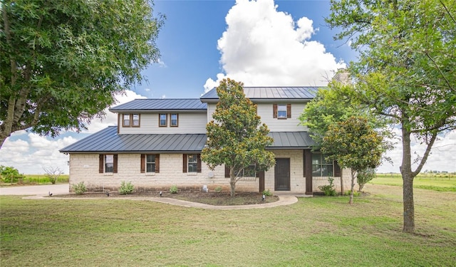 view of front of home featuring a front yard